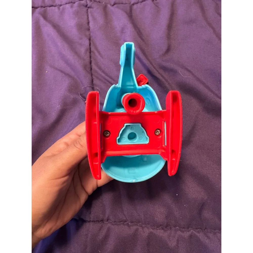 Blue and Red Toy Helicopter with Spinning Rotors and Friendly Face